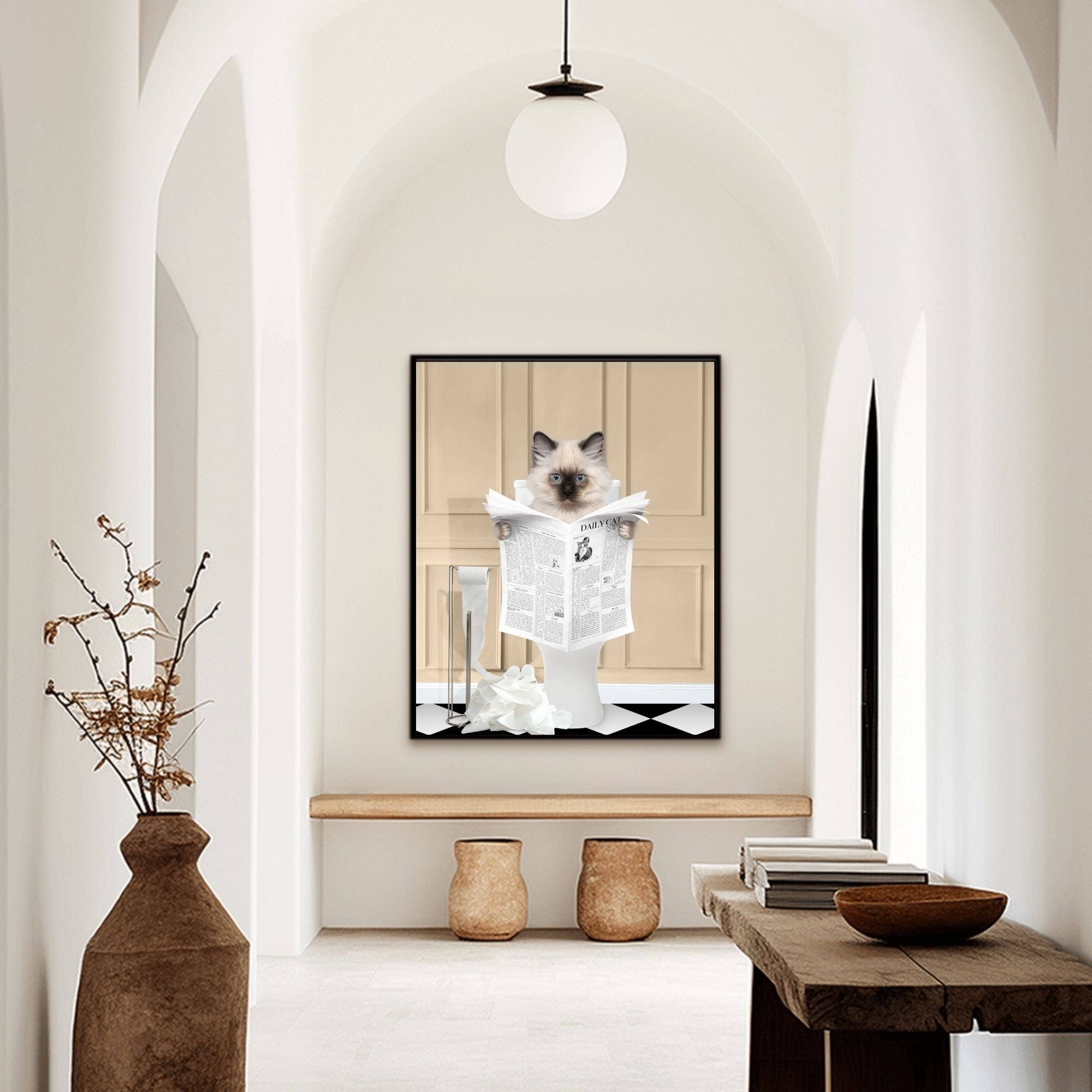 Custom bathroom cat hallway portrait. Siamese kitten holding newspaper on toilet with black and white checker tiled floor.