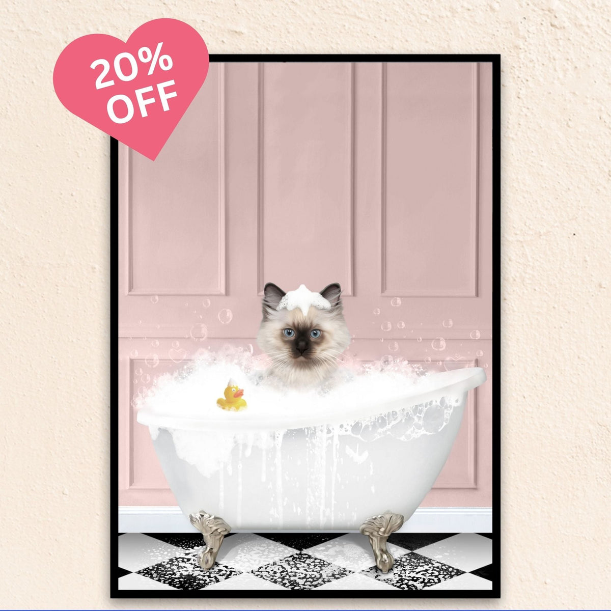 Playful pink backdrop cat portrait of a feline lounging in a bubble-filled tub with a duck.