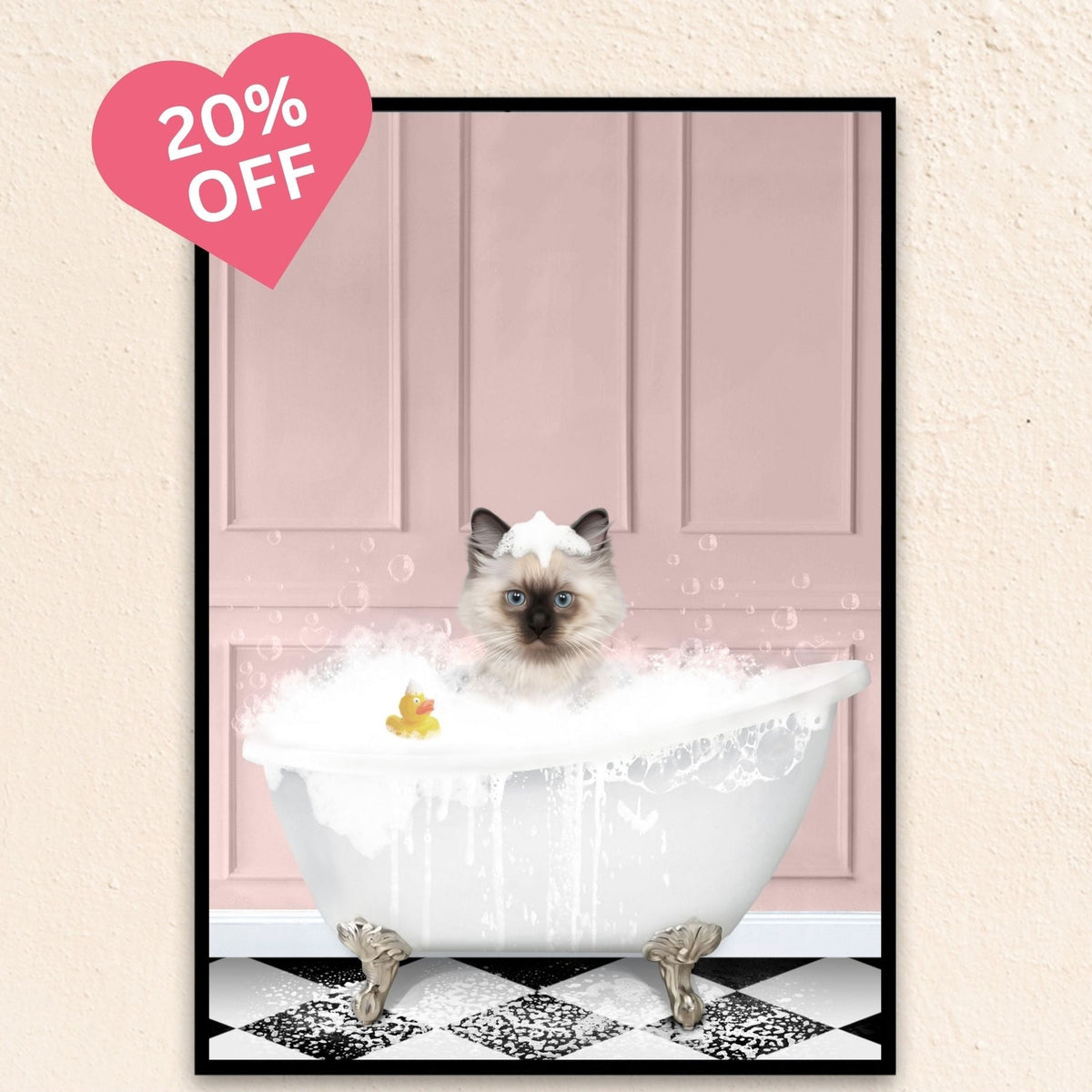 Playful pink backdrop cat portrait of a feline lounging in a bubble-filled tub with a duck.