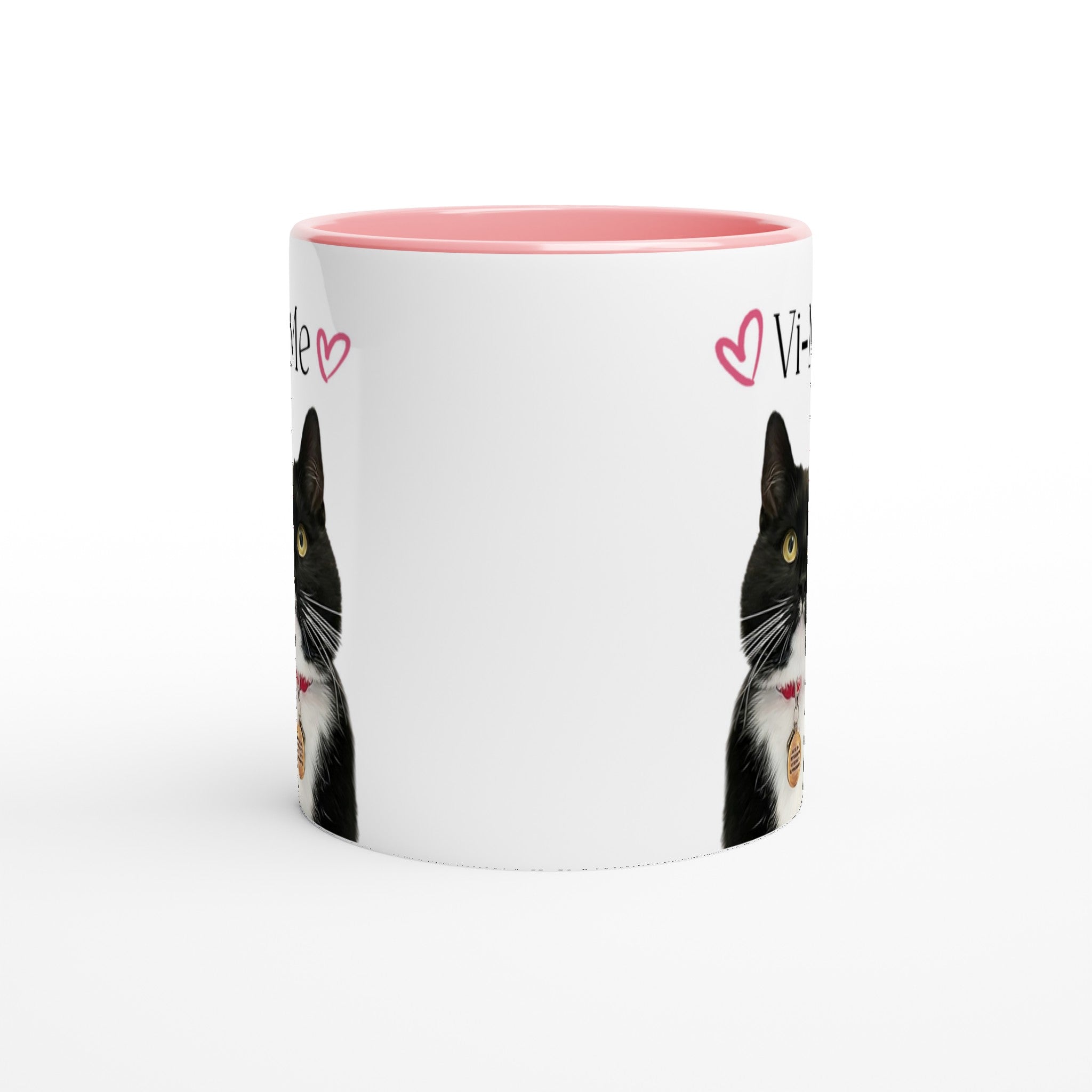 Custom pet portrait mug. Black and white cat with pet name above cat with pink mug interior and handle.