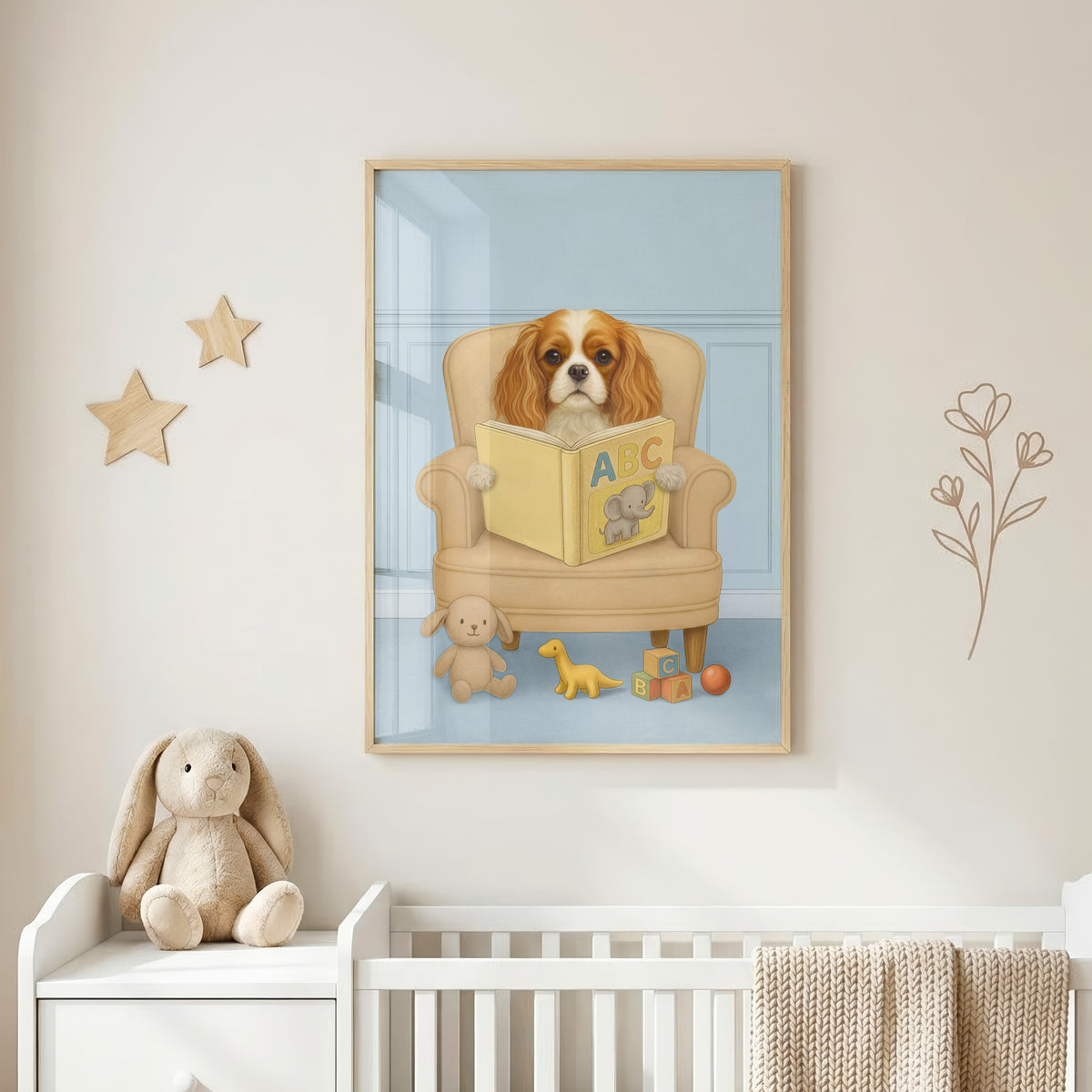 Close-up of custom pet portrait in light blue background color, showing a pup reading a yellow ABC book with an elephant illustration, surrounded by plush toys and alphabet blocks.