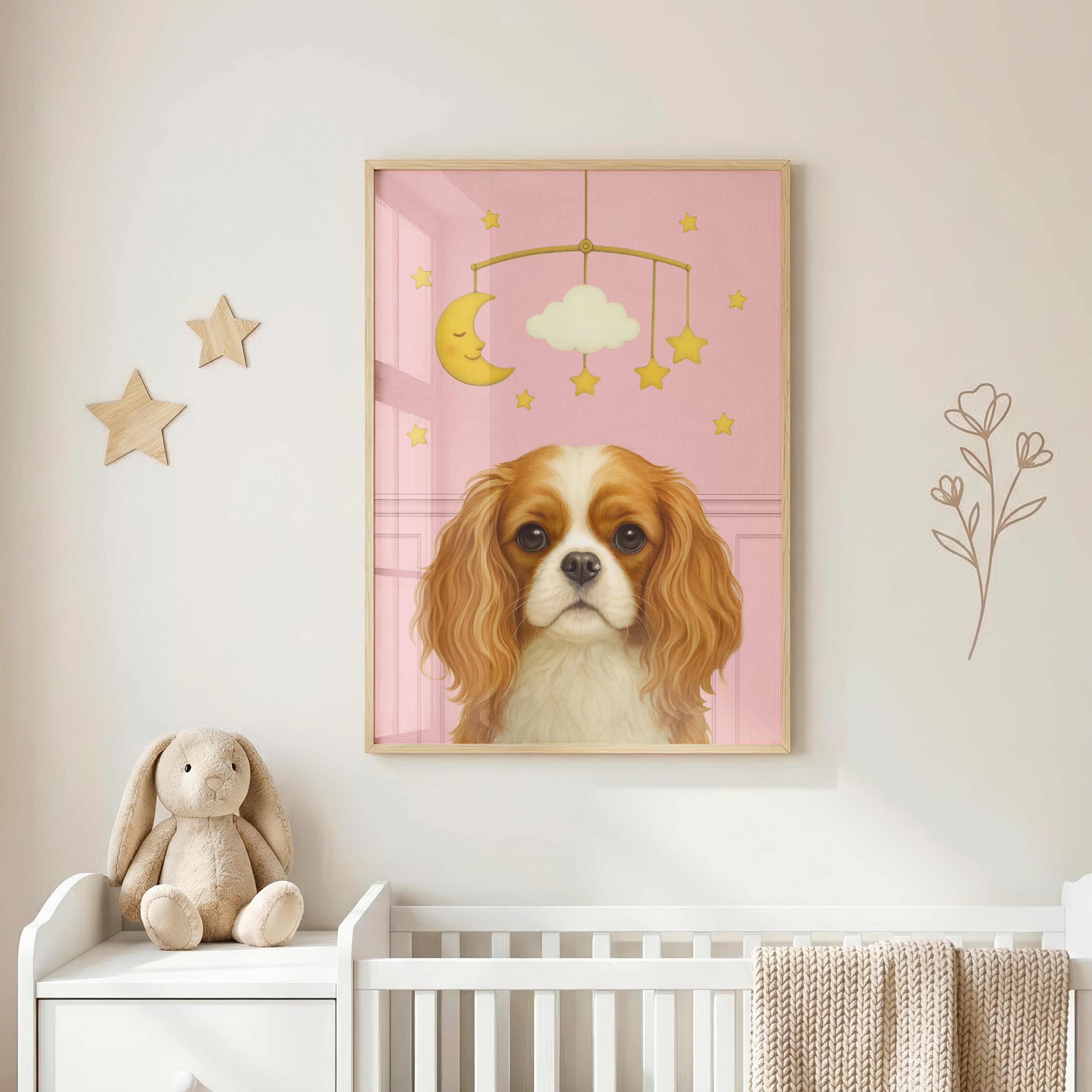 Close-up of handcrafted nursery pet portrait in baby pink backdrop showcasing a charming pup seated beneath a whimsical mobile.