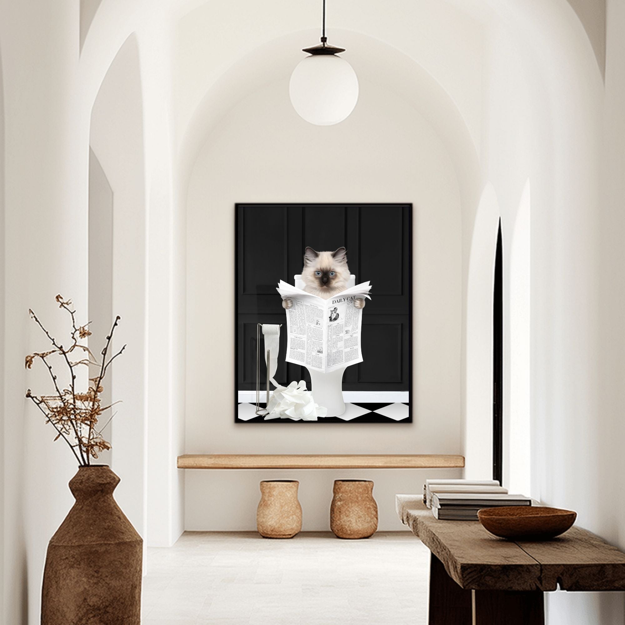 Custom bathroom cat hallway portrait. Siamese kitten holding newspaper on toilet with black and white checker tiled floor.