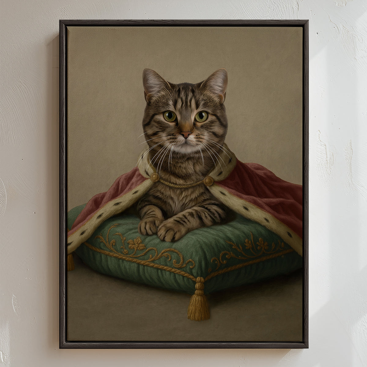 Modern cat royal portrait showing a refined feline adorned in a rose mantle, resting gracefully on a green sage pillow with intricate embroidery, framed by a textured concrete backdrop that adds understated depth.